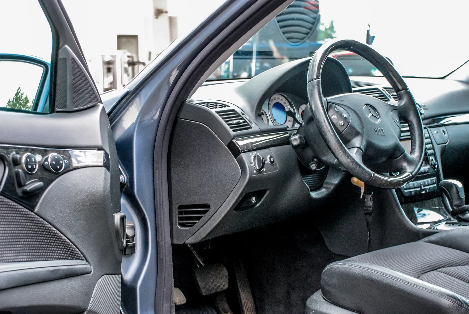 A detailed view of a clean car dashboard and steering wheel